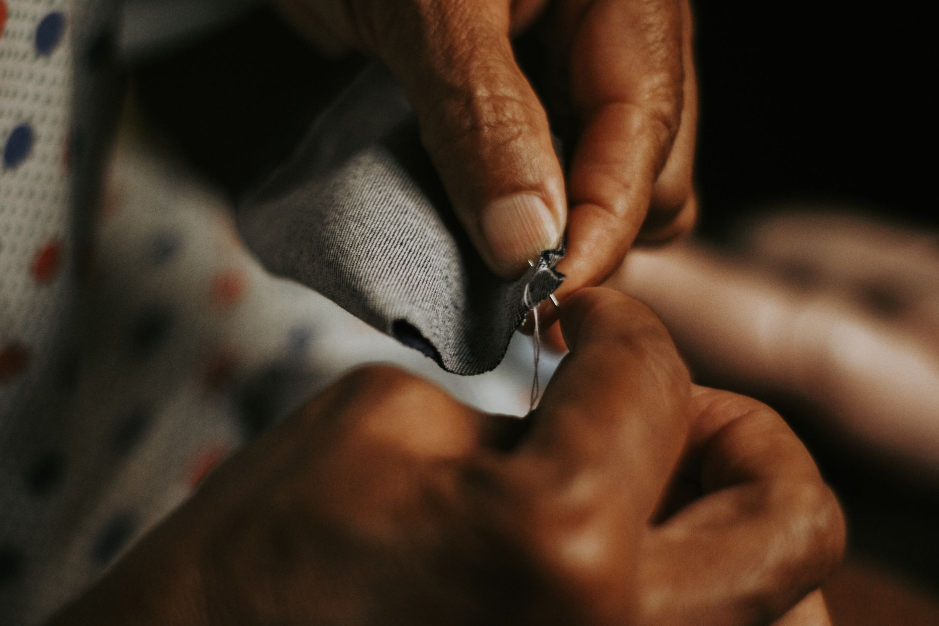 tailor hands sewing