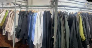 A long rack filled with a wide variety of coats and jackets in the store.